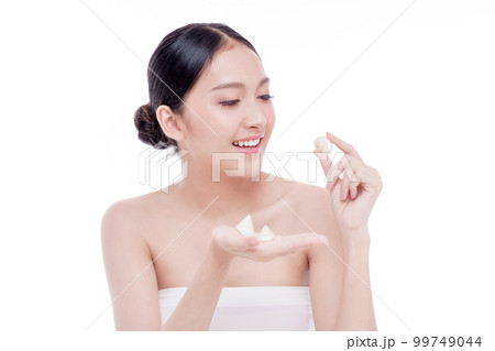 Woman holding Shells polished to pearly surface. The polished shells before being used to make pearl jewelry 99749044