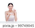 Woman holding Shells polished to pearly surface. The polished shells before being used to make pearl jewelry 99749045