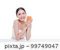 Portrait of Beautiful young woman holding orange juicy and smile isolated on white background. 99749047