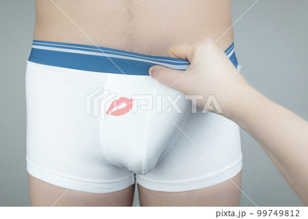 Close up of a man in white underwear. The girl