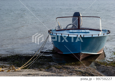 the boat stands on the bank of the river. Means of transportation on water 99750227