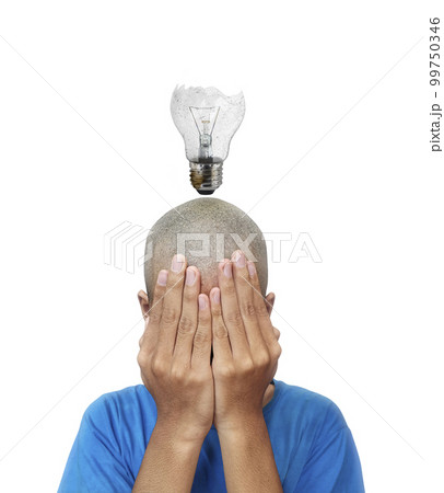 The idea of a man, with a glowing old broken light bulb in the middle 99750346