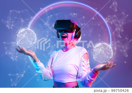 Metaverse technology. Woman wear vr goggles headset connecting digital virtual reality world. Global interface experience. Online gaming and entertainment. Metaverse technology. Woman wear vr goggles headset connecting digital virtual reality world. Global interface experience. Online gaming and entertainment. 99750426