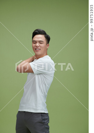 Handsome young man feeling the pain in hand 99751935