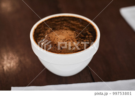 Barista preparing to test and inspecting the quality of coffee Barista preparing to test and inspecting the quality of coffee 99753801