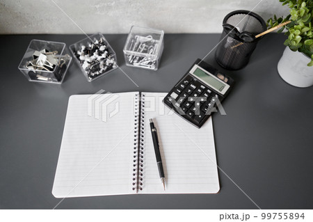 Office desk table with supplies, paper, calculator. Top view with copy space. Selective focus. Business Financing Accounting Banking Concept 99755894