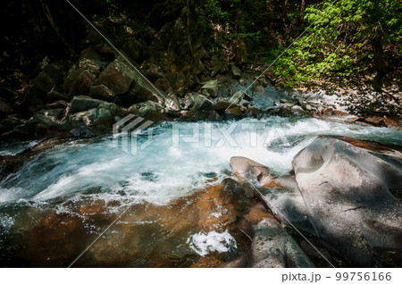 Blue Lagoon, mountain river among the rocks in the forest 99756166