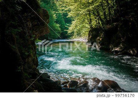 Blue Lagoon, mountain river among the rocks in the forest Blue Lagoon, mountain river among the rocks in the forest 99756170