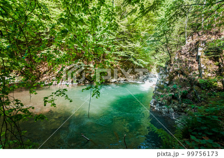 Blue Lagoon, mountain river among the rocks in the forest 99756173