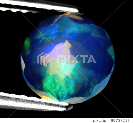 Natural beautiful gemstone opal on gray background 99757212