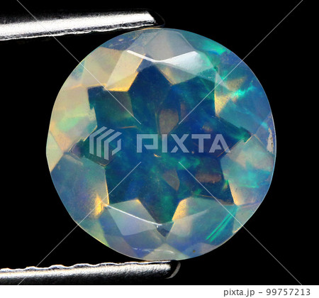 Natural beautiful gemstone opal on gray background 99757213