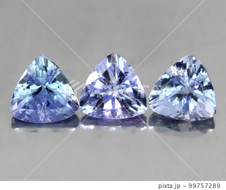 Beautiful natural tanzanite stone on gray background 99757289