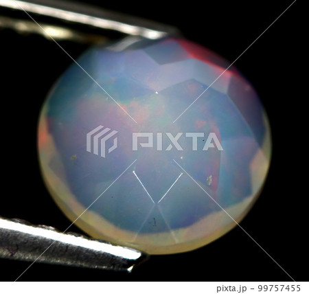 Natural beautiful gemstone opal on gray background 99757455
