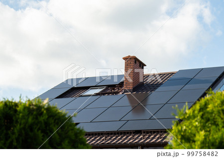 New ecologic house with solar panels Alternative to conventional energy. The battery is charged from a solar cell Advertisement Green energy Sustainable life Renewable  99758482