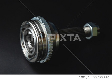 New CV joint on a black background. Constant velocity joint. New spare part 99759432