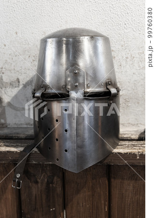 Closed iron helmet of crusader knight armor 99760380
