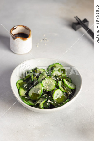 Japanese Sunomono salad with wakame seaweed and cucumber in bowl. 99761855