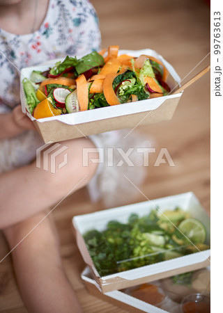 Healthy salad of broccoli, green peas, cucumber and avocado and olive oil. Healthy food. Top view, copy space. 99763613