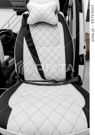 Comfortable interior of a passenger bus with soft seats 99763697
