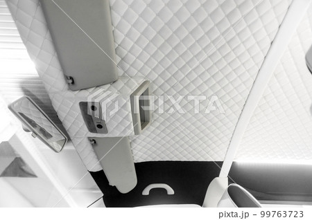 Comfortable interior of a passenger bus with soft seats Comfortable interior of a passenger bus with soft seats 99763723