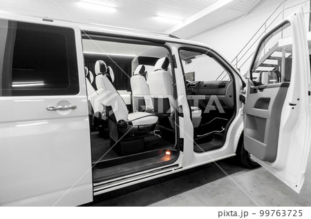 Comfortable interior of a passenger bus with soft seats 99763725