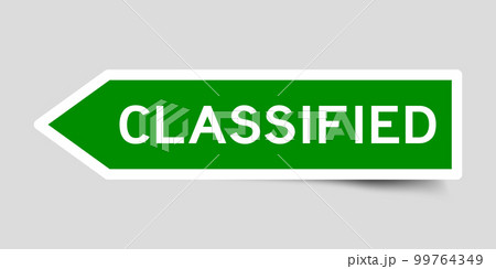 Green color arrow shape sticker label with word classified on gray background Green color arrow shape sticker label with word classified on gray background 99764349