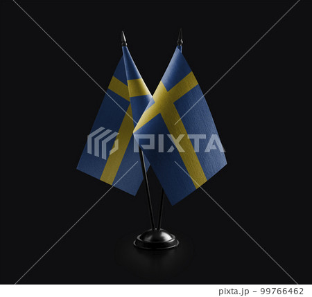 Small national flags of the Sweden on a black background 99766462