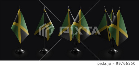 Small national flags of the Jamaica on a black background 99766550