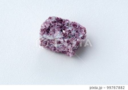Lepidolite stone on a white background, being a secondary source of lithium, used in batteries Lepidolite stone on a white background, being a secondary source of lithium, used in batteries 99767882