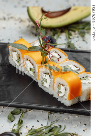 Rainbow Sushi Roll with salmon, eel, tuna, avocado, royal prawn, cream cheese Philadelphia, caviar tobica, chuka. Sushi menu. Japanese food. Rainbow Sushi Roll with salmon, eel, tuna, avocado, royal prawn, cream cheese Philadelphia, caviar tobica, chuka. Sushi menu. Japanese food. 99767953