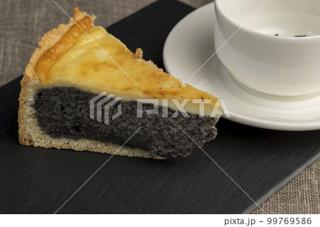 Delicious poppy seed cake with a thin sponge cake and lots of poppy seed filling 99769586