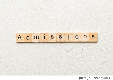 admissions word written on wood block. admissions text on table, concept 99771803