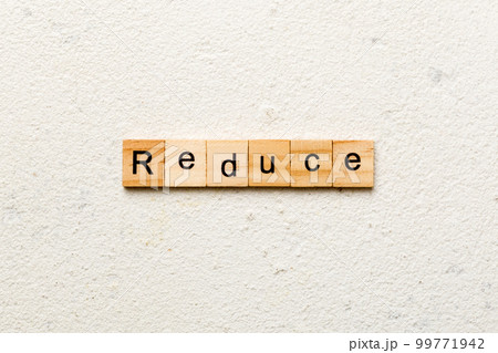 reduce word written on wood block. reduce text on cement table for your desing, concept reduce word written on wood block. reduce text on cement table for your desing, concept 99771942