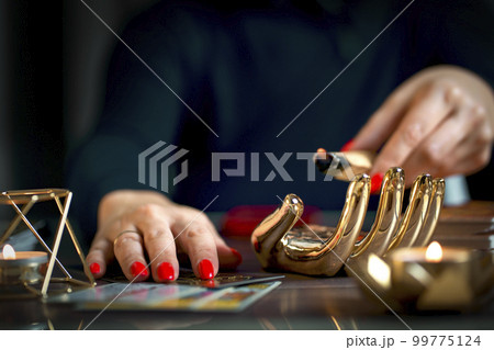 Blurred tarot cards on the table, esoteric concept, fortune telling predictions Blurred tarot cards on the table, esoteric concept, fortune telling predictions 99775124