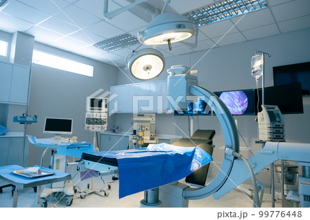 Empty operating room with bed 99776448