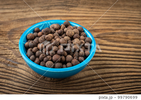 Allspice spice in a small bowl on the table Allspice spice in a small bowl on the table 99790699