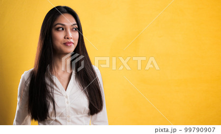 Young pretty woman points to something Young pretty woman points to something 99790907
