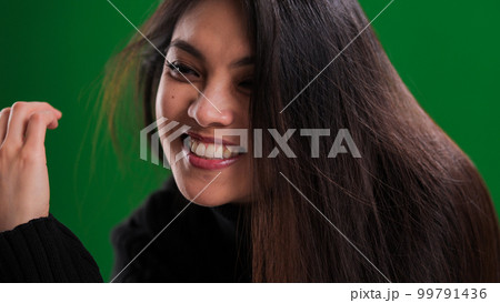 Close-up of a pretty young woman with asian appearance Close-up of a pretty young woman with asian appearance 99791436