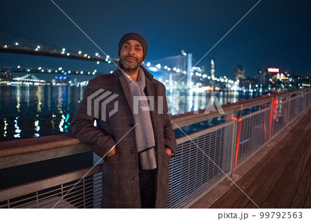 Afro American Man at Brooklyn Bridge by night - travel photography 99792563