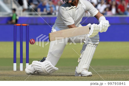 Cricket players batsman hitting ball in a stadium. Cricket players batsman hitting ball in a stadium. 99793841