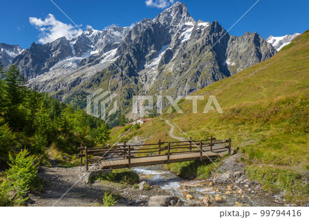 Landscape of Aosta valley near Mont Blanc massif with river and bridge, Italy Landscape of Aosta valley near Mont Blanc massif with river and bridge, Italy 99794416