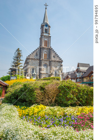 Stone Church with colorful flowerbed, Gramado village, Southern Brazil Stone Church with colorful flowerbed, Gramado village, Southern Brazil 99794695
