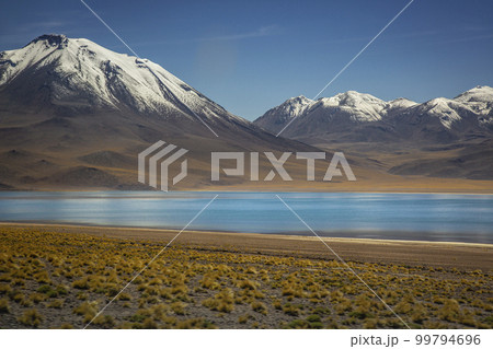 Salt lake, turquoise Laguna Miscanti, volcanic landscape at sunrise, Atacama Salt lake, turquoise Laguna Miscanti, volcanic landscape at sunrise, Atacama 99794696