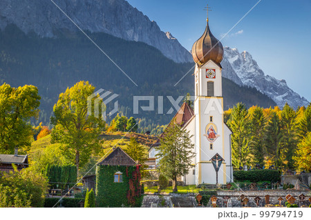 Grainau Church at golden autumn and Zugspitze, Garmisch Partenkirchen, Germany Grainau Church at golden autumn and Zugspitze, Garmisch Partenkirchen, Germany 99794719