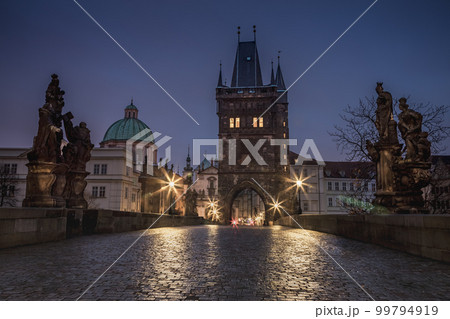 Charles Bridge, Prague at dramatic evening, Czech Republic, with night lighting Charles Bridge, Prague at dramatic evening, Czech Republic, with night lighting 99794919