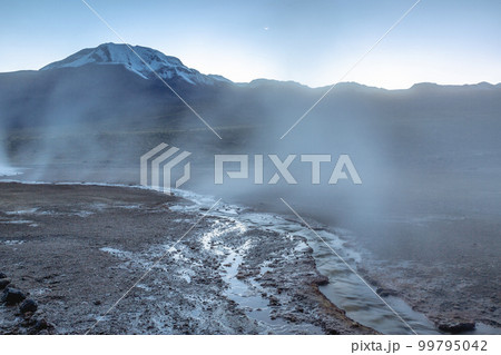 Geysers El Tatio with river and volcanic landscape at sunrise, Atacama, Chile 99795042