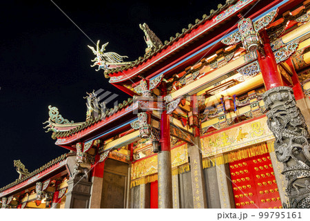 Night view of Xingtian Temple building in Taipei, Taiwan. The temple is devoted to Lord Guan. In 2014, it's became the first in Taiwan to ban the burning of incense. 99795161
