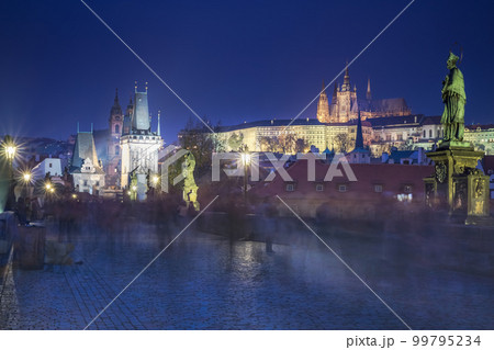 Charles Bridge, Prague at dramatic evening, Czech Republic, with night lighting 99795234