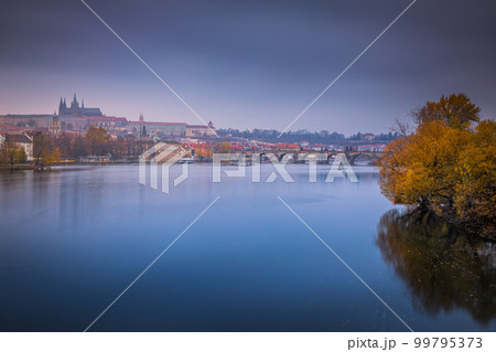 Panoramic view over the cityscape of Prague at dramatic dusk, Czech Republic Panoramic view over the cityscape of Prague at dramatic dusk, Czech Republic 99795373