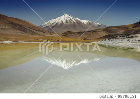 Salt lake in Piedras Rojas, volcanic landscape at sunrise, Atacama, Chile 99796151